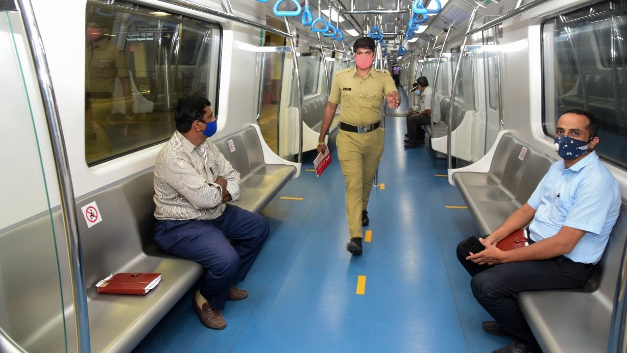 Passengers are being fined Rs 250 for riding without masks in the metro train. Credit: DH file photo/B H Shivakumar