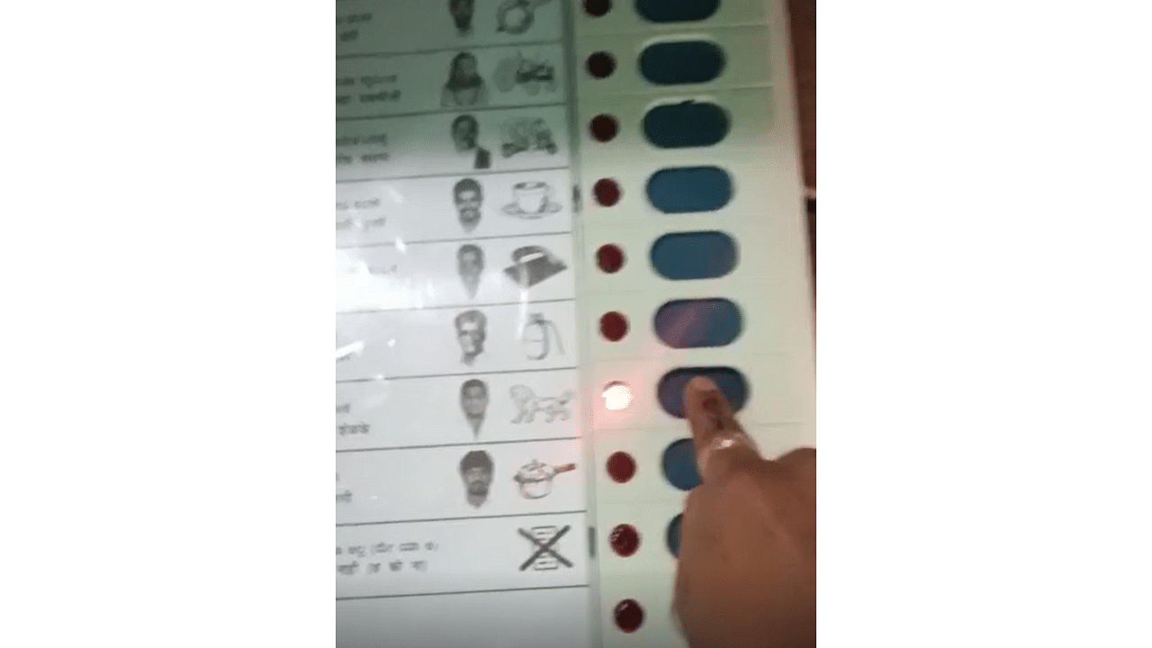 In the 11-second video, the unidentified voter who shot the video can be seen running his finger across the ballot unit, voting for Shelke and then raising his thumb. Credit: Special Arrangement
