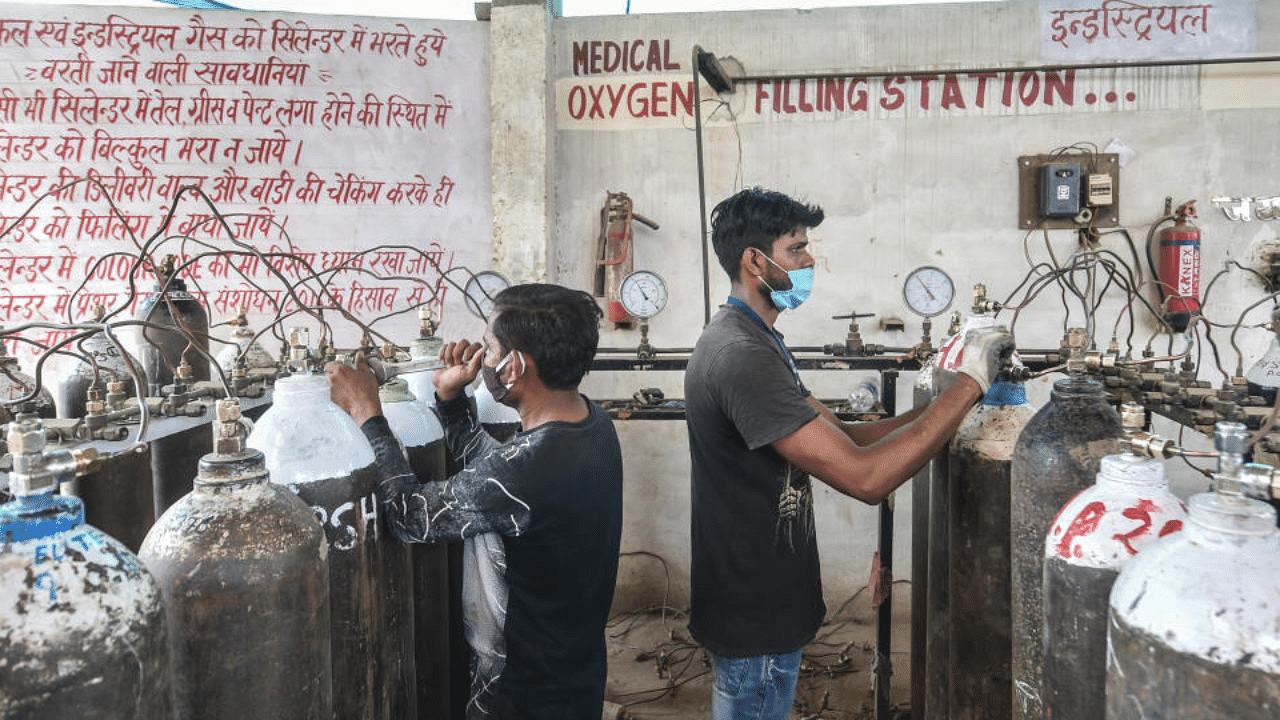 Empty oxygen cylinders is being refilled, to be transported to hospitals for Covid-19 patients, amid the rise in Covid-19 cases across the country, in Lucknow, Thursday, April 15, 2021. Credit: PTI Photo