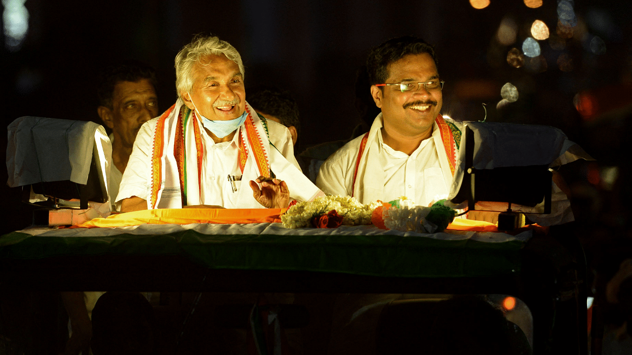 Former chief minister of India's Kerala state Oommen Chandy (L) attends a public rally ahead of the Kerala state legislative assembly elections in Kochi. Credit: AFP Photo