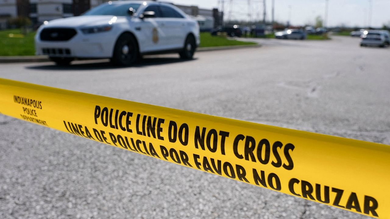 Police caution tape blocks the entrance to the site of a mass shooting at a FedEx facility in Indianapolis, Indiana. Credit: AFP photo