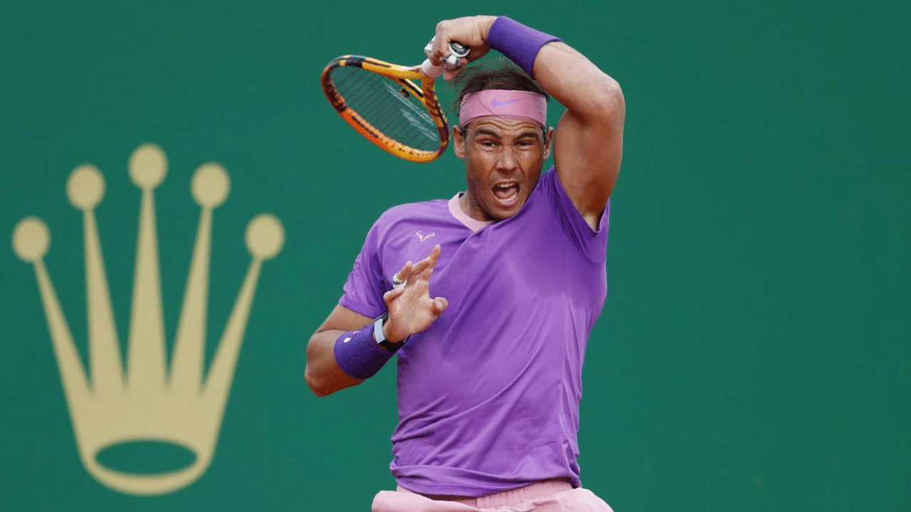 Rafael Nadal of Spain follows his shot to Andrey Rublev of Russia during their quarterfinal match of the Monte Carlo Tennis Masters tournament in Monaco. Credit: AP photo. 
