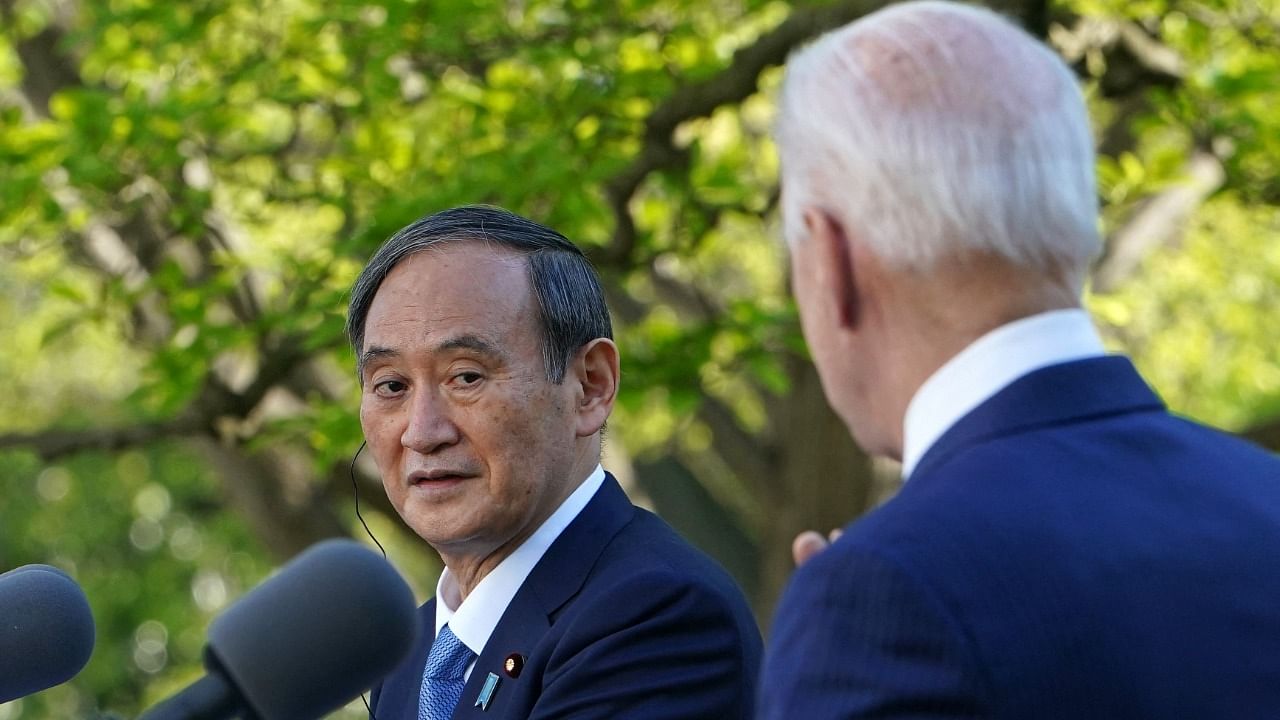 US President Joe Biden and Japan's Prime Minister Yoshihide Suga take part in a joint press conference in the Rose Garden of the White House in Washington. Credit: AFP photo