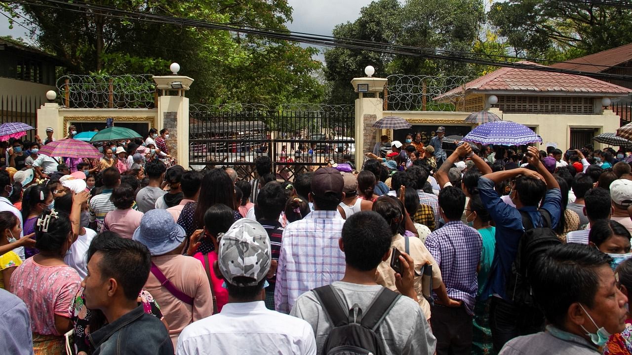 Relatives and friends wait outside the Insein Prison, as Myanmar's junta released prisoners from jails. Credit: Reuters Photo