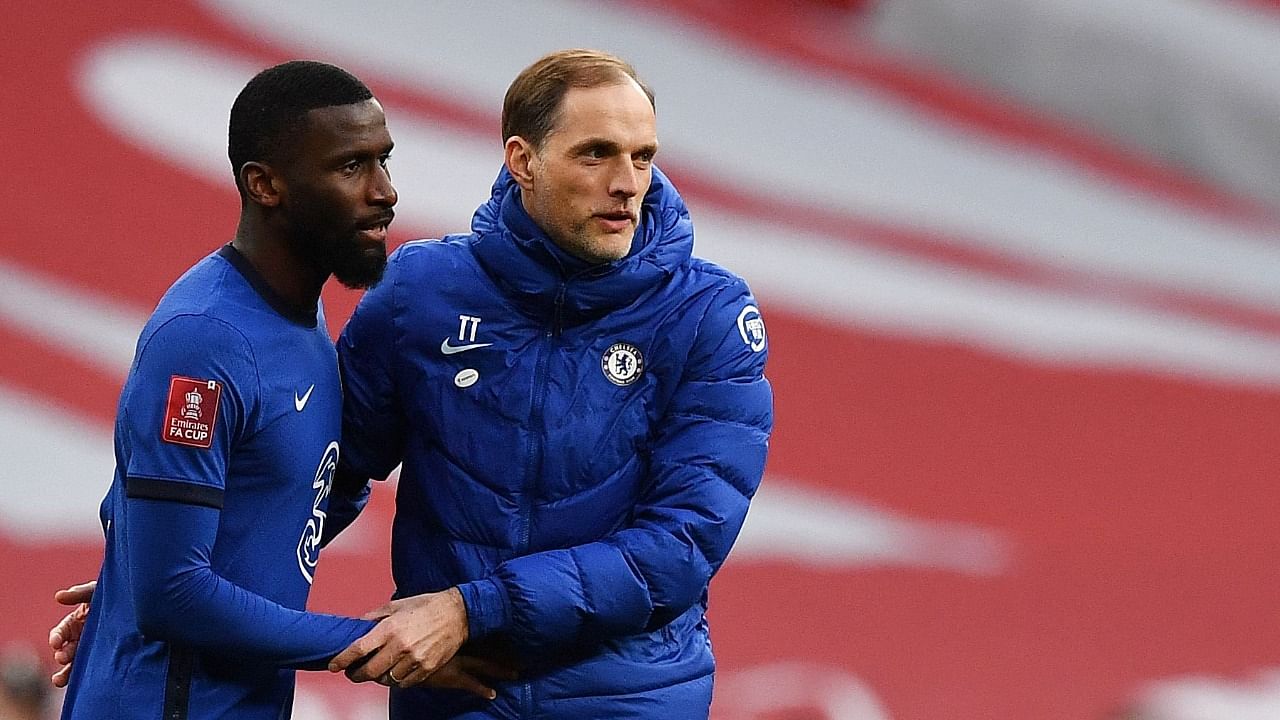 Chelsea's German head coach Thomas Tuchel (R) celebrates with Chelsea's German defender Antonio Rudiger after the English FA Cup semi-final football match between Chelsea and Manchester City at Wembley Stadium. Credit: AFP photo
