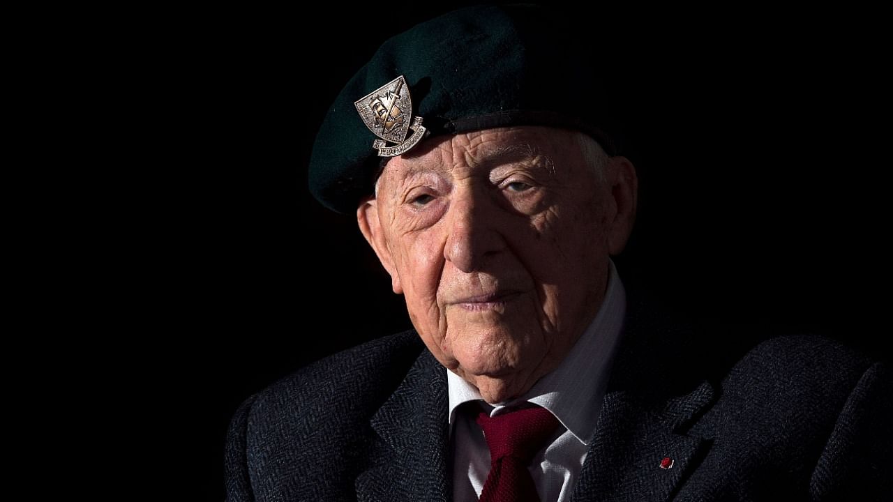 In this file photo taken in Paris on April 08, 2014, shows Hubert Faure, a former member of the Kieffer commandos, a group of 177 French soldiers who took part in The Invasion of Normandy known as the Operation Overlord during the World War II. Credit: AFP file photo