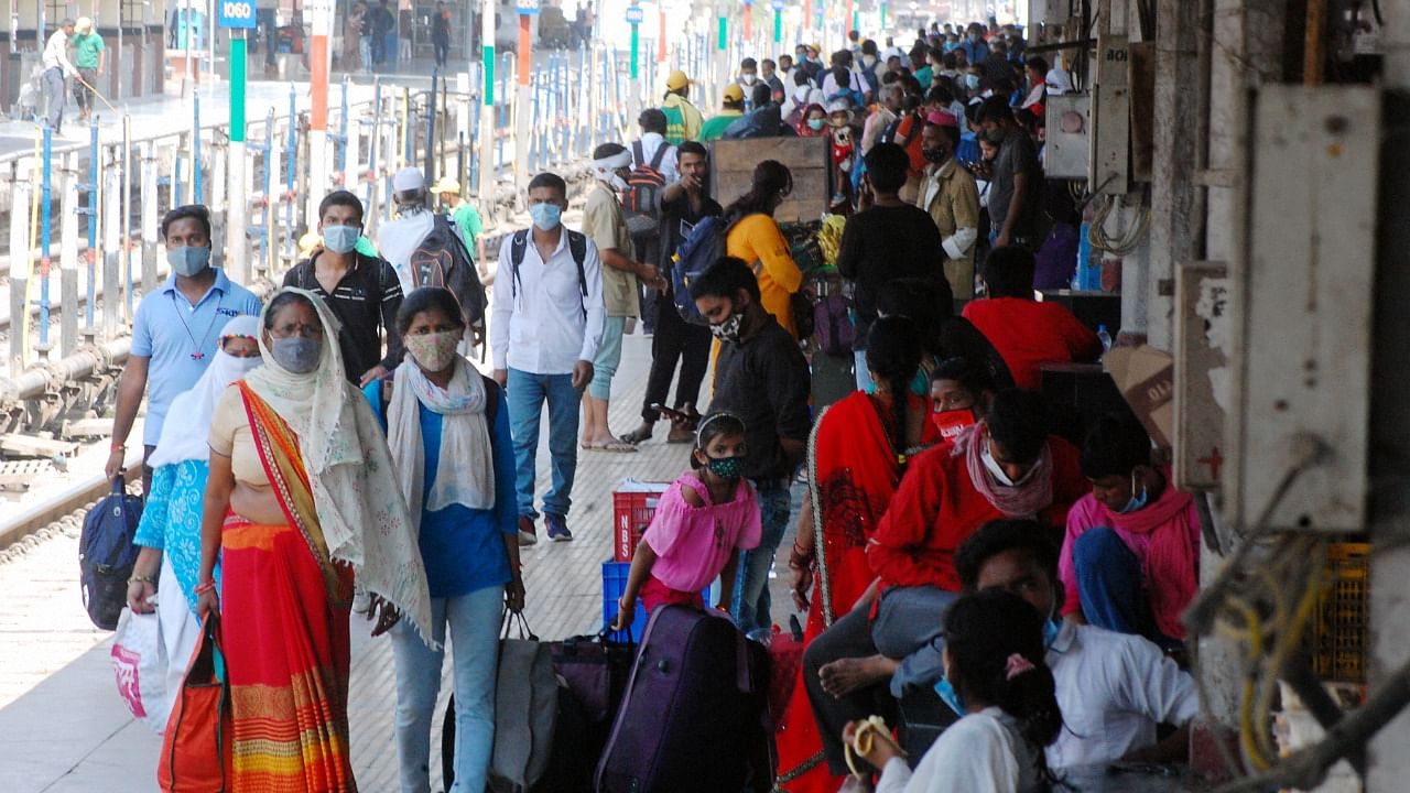 Passengers wait to board trains, amid the ongoing surge in coronavirus cases in Kanpur, Saturday, April 17, 2021. Credit: PTI Photo