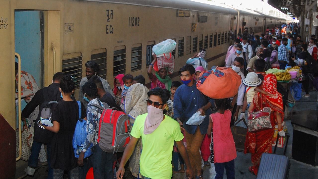 Passengers wait to board trains, amid the ongoing surge in coronavirus cases in Kanpur, Saturday, April 17, 2021. Credit: PTI Photo