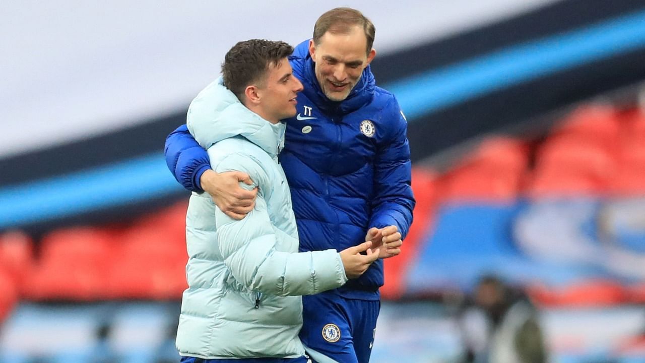 Chelsea's German head coach Thomas Tuchel (R) celebrates with Chelsea's English midfielder Mason Mount on the pitch after the English FA Cup semi-final football match between Chelsea and Manchester City at Wembley Stadium. Credit: AFP photo