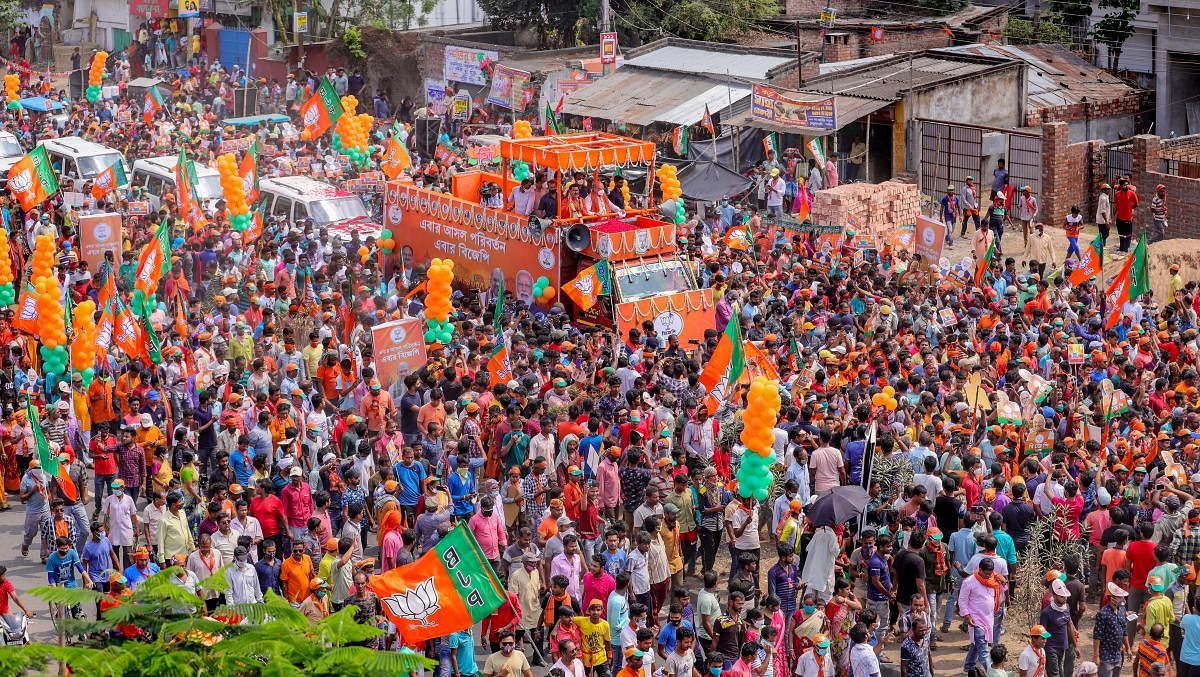 Union Home Minister Amit Shah during a roadshow in support of BJP candidates, ahead of the 6th phase of West Bengal Assembly polls, at Bethuadahari in Nadia district, Sunday, April 18, 2021. Credit: PTI Photo