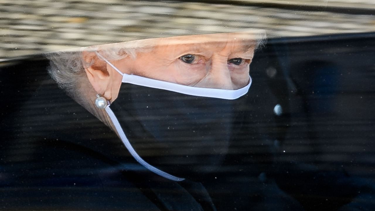 Britain's Queen Elizabeth II travels in the State Bentley during the ceremonial funeral procession of Britain's Prince Philip, Duke of Edinburgh to St George's Chapel in Windsor Castle in Windsor, west of London, on April 17, 2021. Credit: AFP Photo