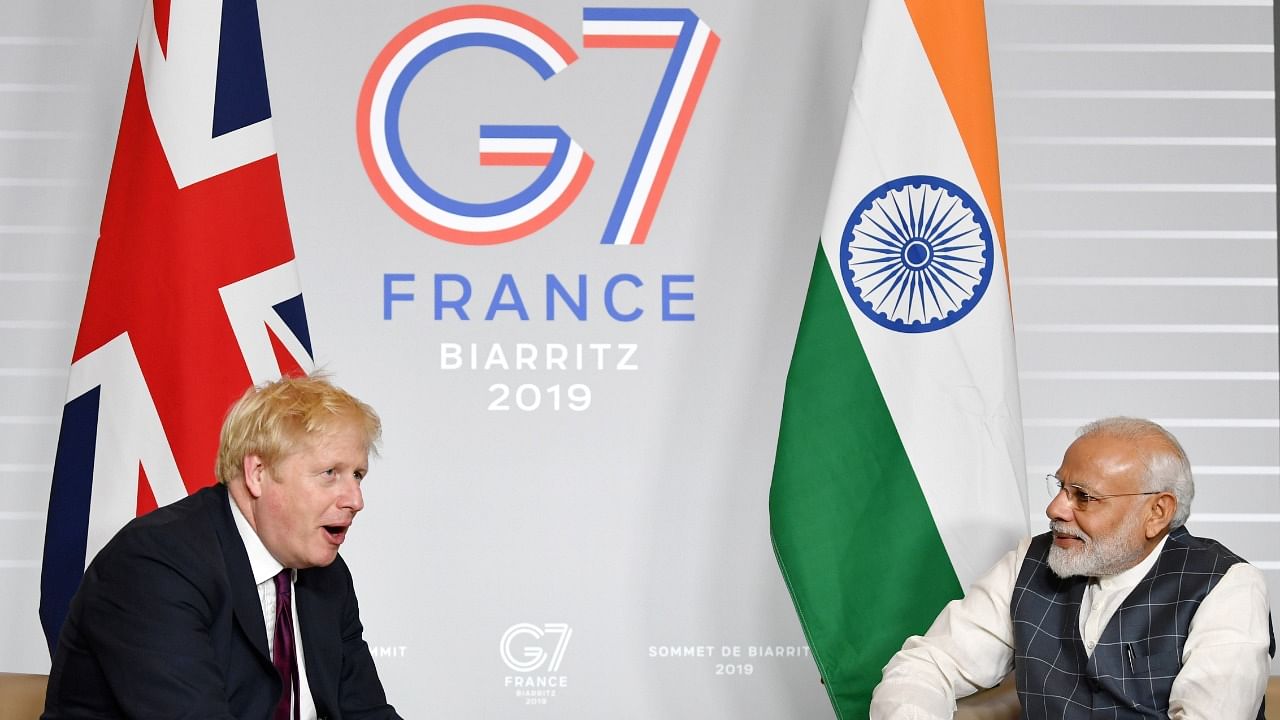 UK's Boris Johnson and PM Modi at the G7 Summit in 2019. Credit: Reuters File Photo