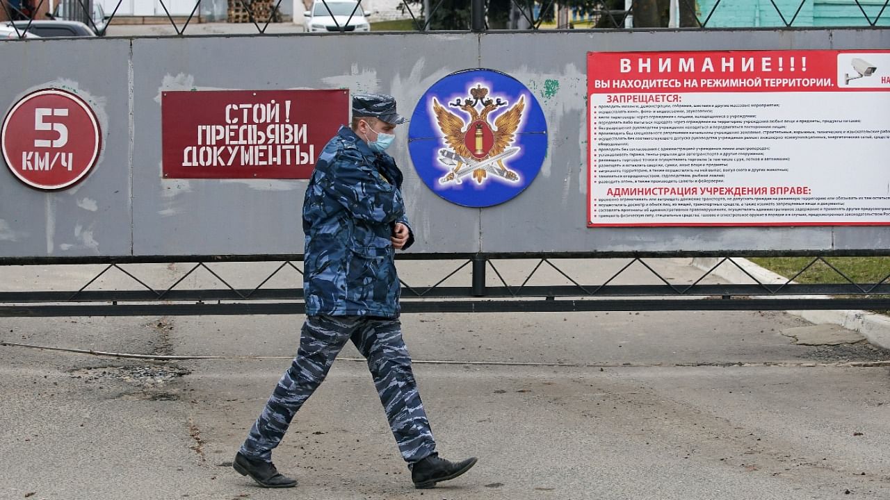 An officer walks outside the IK-3 penal colony, which houses a hospital where jailed Kremlin critic Alexei Navalny was reportedly transferred, in Vladimir, Russia April 20, 2021. Credit: Reuters Photo