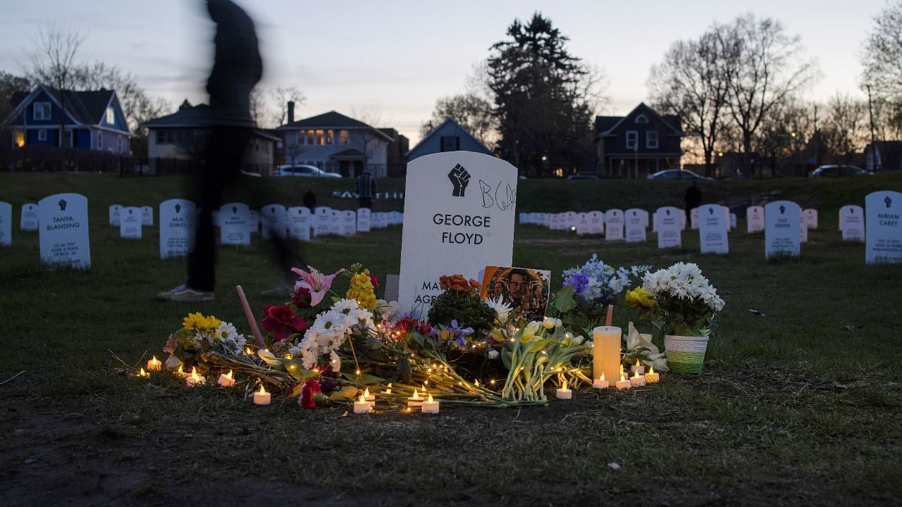 A local resident walks along the "Say Their Names" cemetery on the day of verdict in the trial of former Minneapolis police officer Derek Chauvin, found guilty of the death of George Floyd, at George Floyd Square in Minneapolis, Minnesota, US. Credit: Reuters Photo