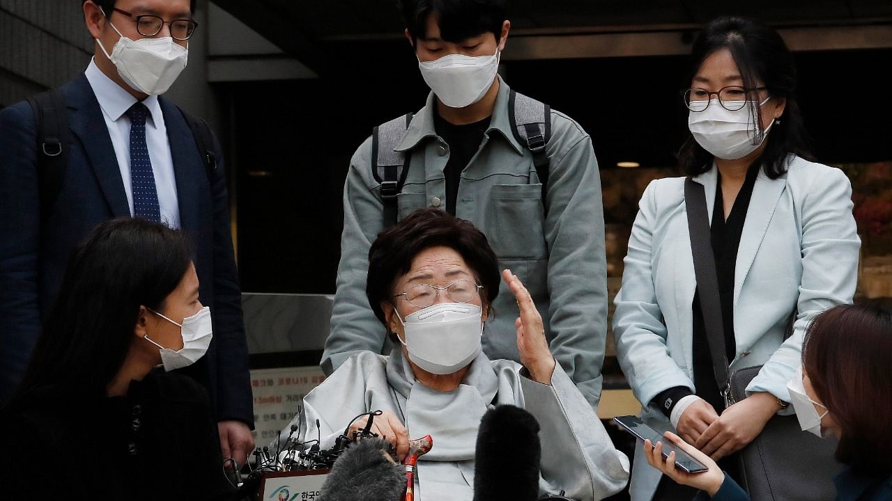 Former South Korean comfort woman Lee Yong-soo, center, speaks before leaving the Seoul Central District Court in Seoul, South Korea, Wednesday, April 21, 2021. Credit: AP/PTI Photo