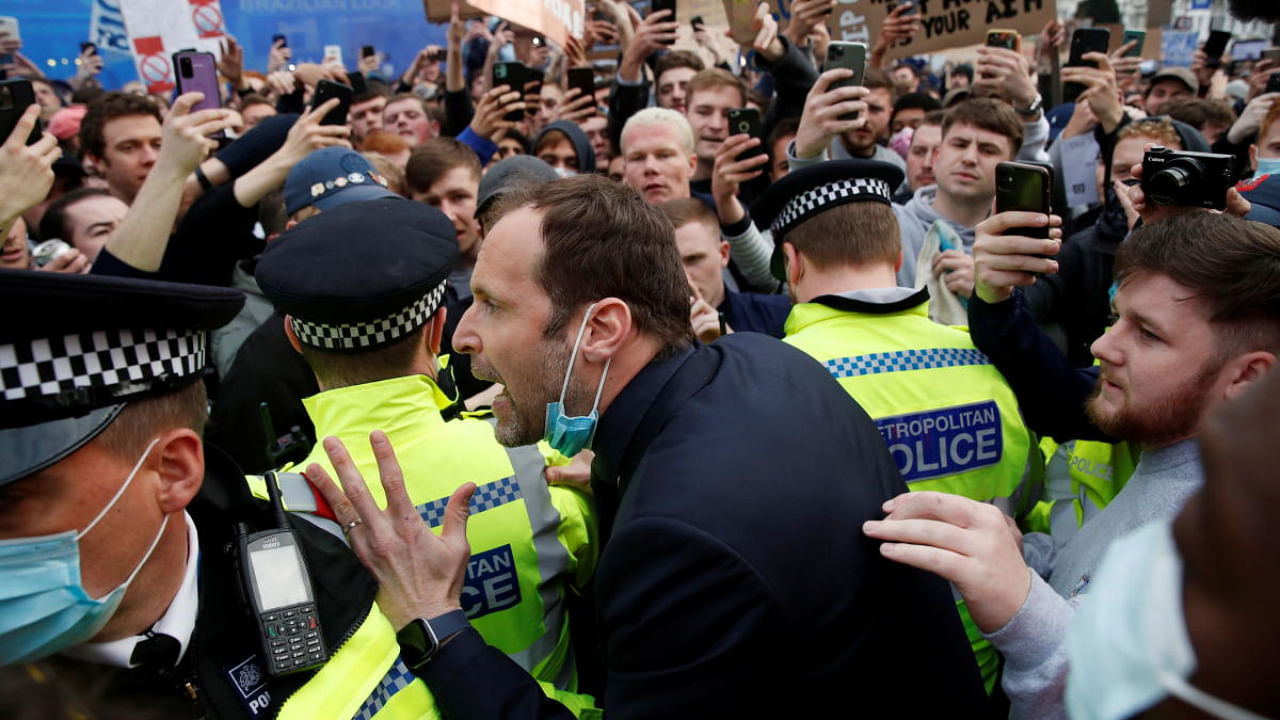  Former Chelsea player Petr Cech spotted talking to fans as Chelsea fans protest against the planned European Super League. Credit: Reuters photo.