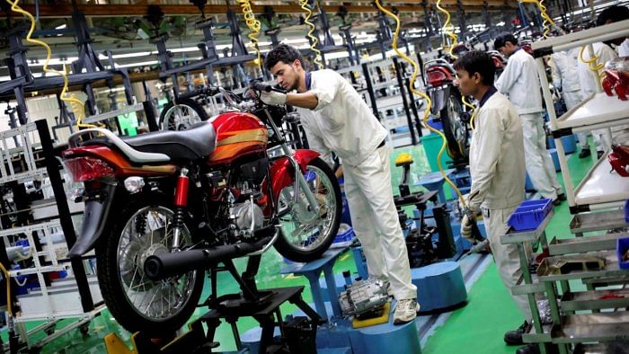 Employees work on an assembly line of a Hero MotoCorp plant in Neemrana. Credit: Reuters File Photo