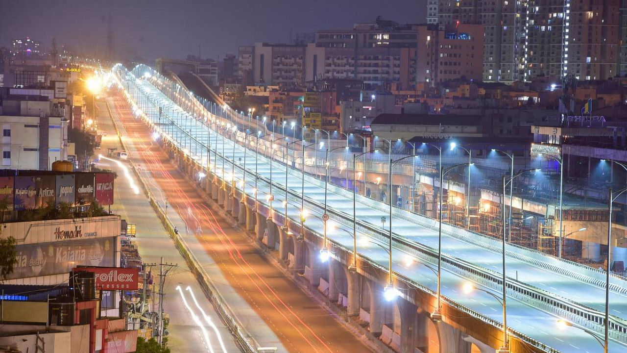 A deserted look of electronic city flyover during night curfew imposed in the wake of rising Covid-19 cases across the country, in Bengaluru. Credit: PTI Photo.