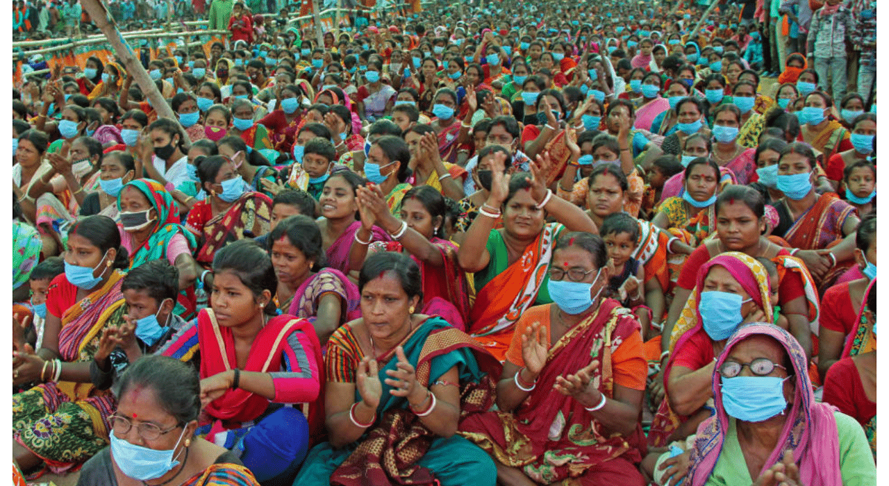 BJP supporters of Suvendu Adhikary being garlanded by party leaders during an election campaign rally for the West Bengal Assembly Polls, at Illambazar in Birbhum district, Saturday, April 17, 2021.  Credit: PTI Photo