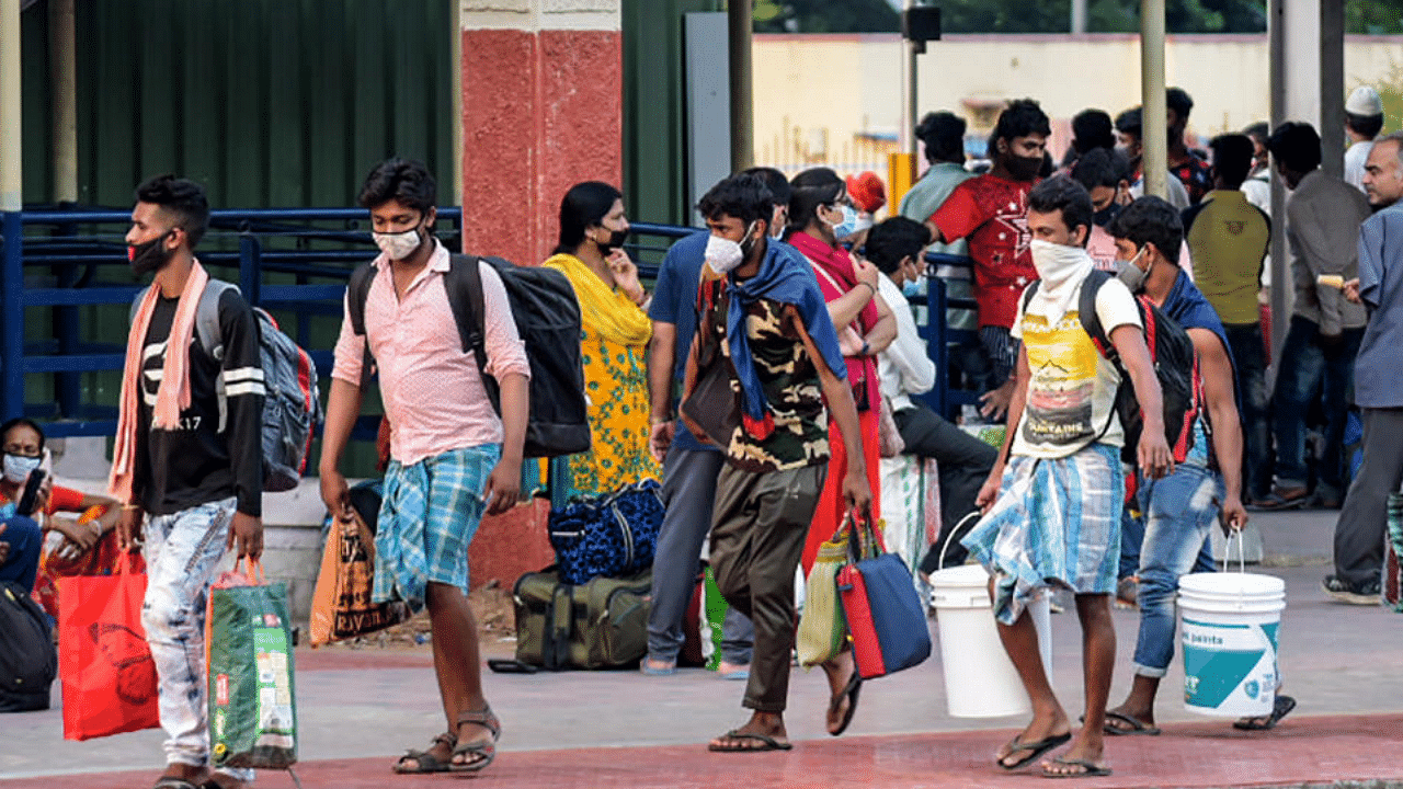 Migrants wait to board trains at Katpadi Railway Station, in anticipation of a lockdown due to surge in coronavirus cases in Vellore district, Wednesday, April 21, 2021. Credit: PTI Photo