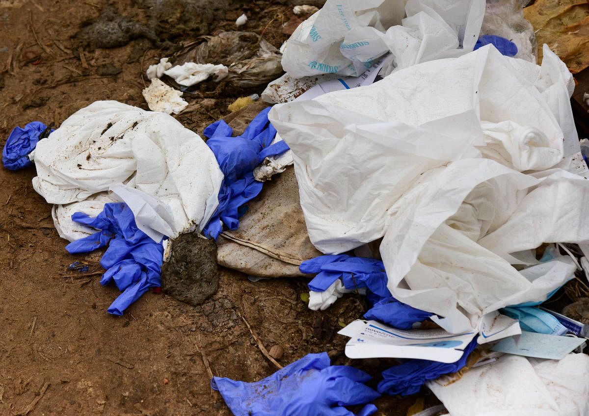 The PPE kits are disposed of in the open areas of the crematoria. Credit: DH photo/representative image.