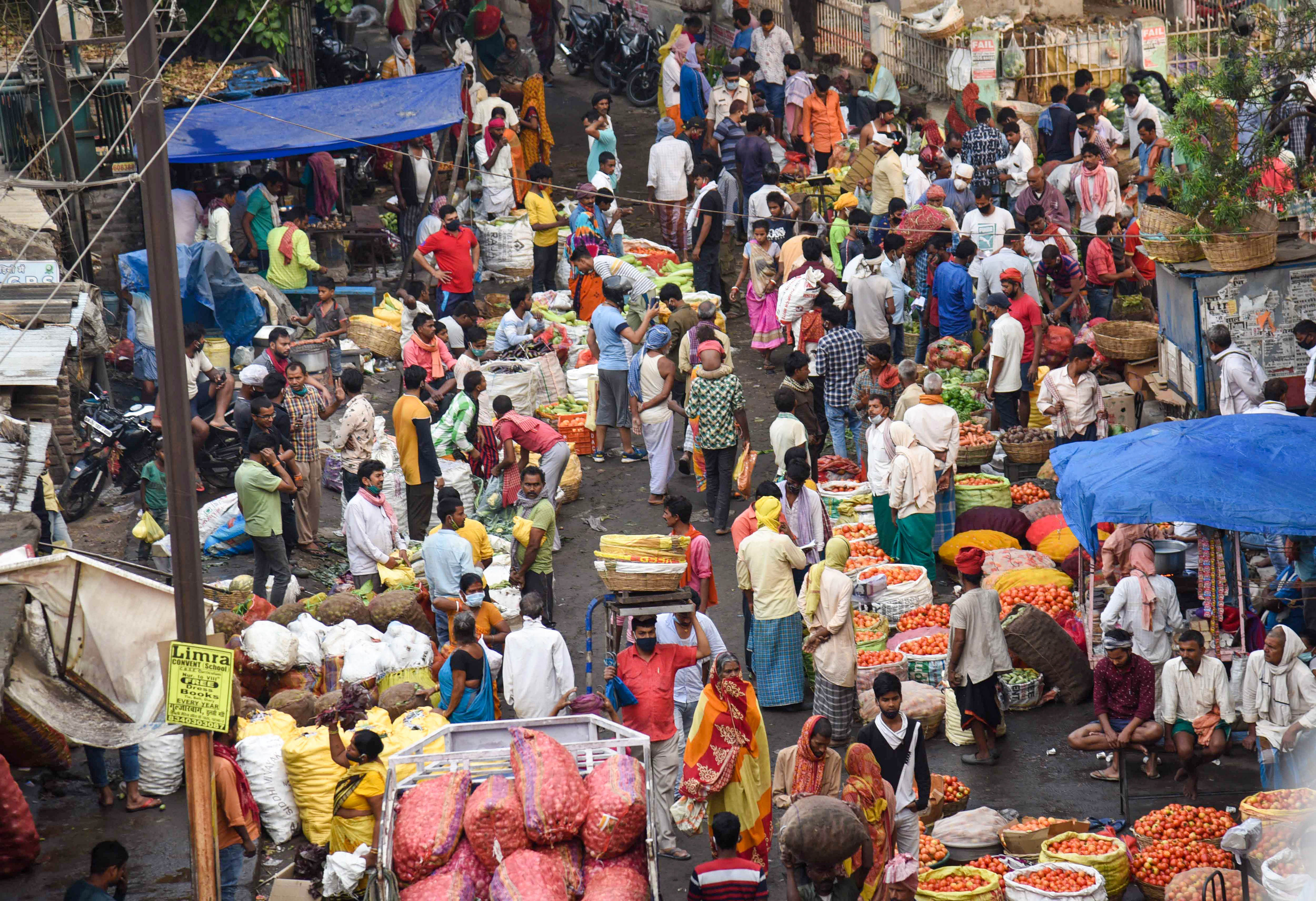 View of a crowded vegetable market at NMCH, as coronavirus cases surge in record numbers in Patna. Credit: PTI Photo