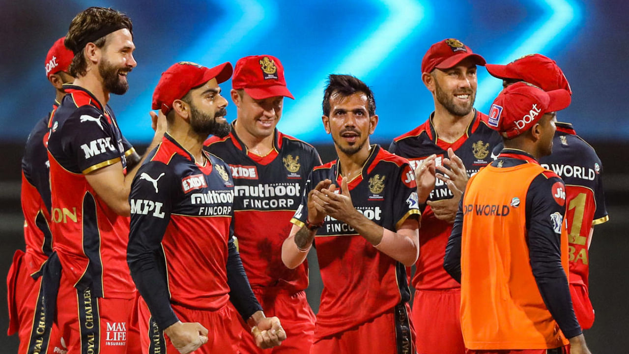 RCB squad celebrate the wicket of Rajasthan Royals' David Miller. Credit: PTI Photo/Sportzpics