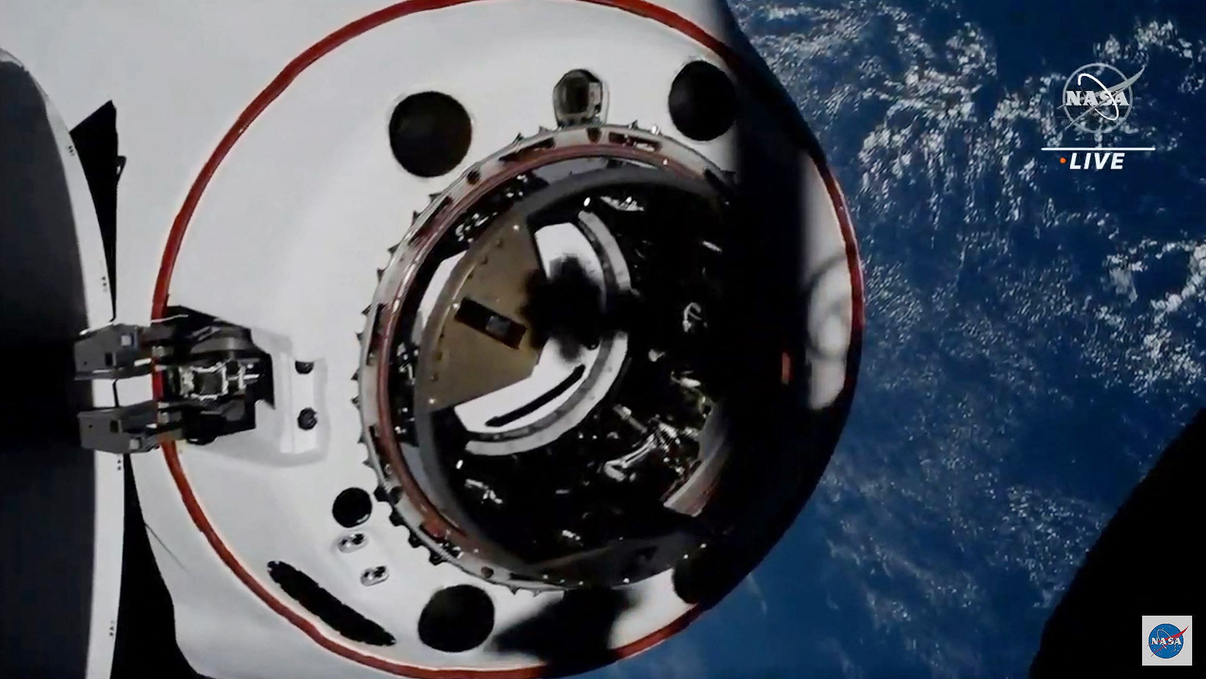 This screen grab taken from the NASA live feed shows the SpaceX's Crew Dragon spacecraft at 2,5 meters of the docking access of the International Space Station. Credit: AFP Photo
