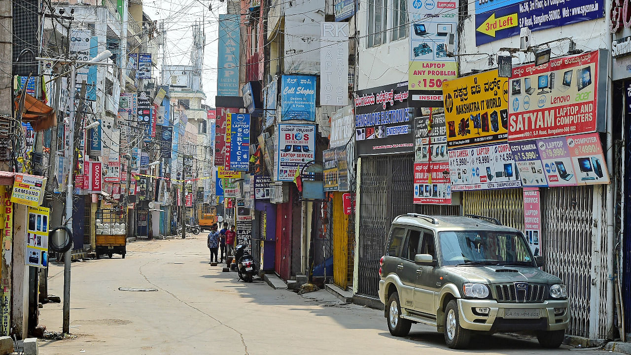 Shops in Bengaluru's SP road shuttered due to the weekend lockdown imposed by the state government. Credit: DH Photo