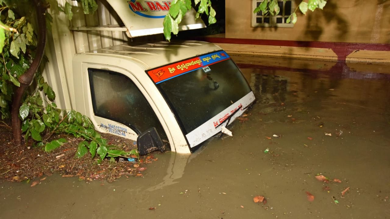 Scores of houses were flooded and hundreds of vehicles damaged in Bengaluru. Credit: DH Photo