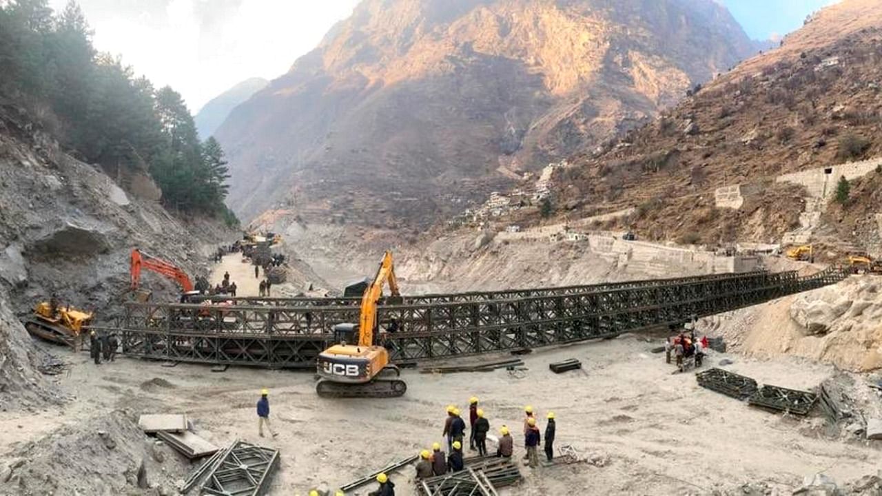 Border Roads Organisation (BRO) workers engaged in building a valley bridge over the Rishi Ganga River at Raini village of the disaster-hit Chamoli district, Thursday, March 4, 2021. Credit: PTI File Photo