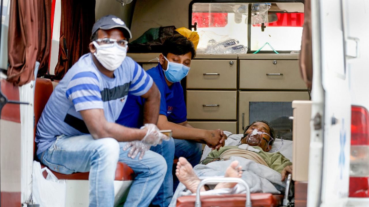 An ambulance carrying Covid-19 patient wait to attended by medical workers, as coronavirus cases surge in Ahmedabad, Credit: PTI File Photo