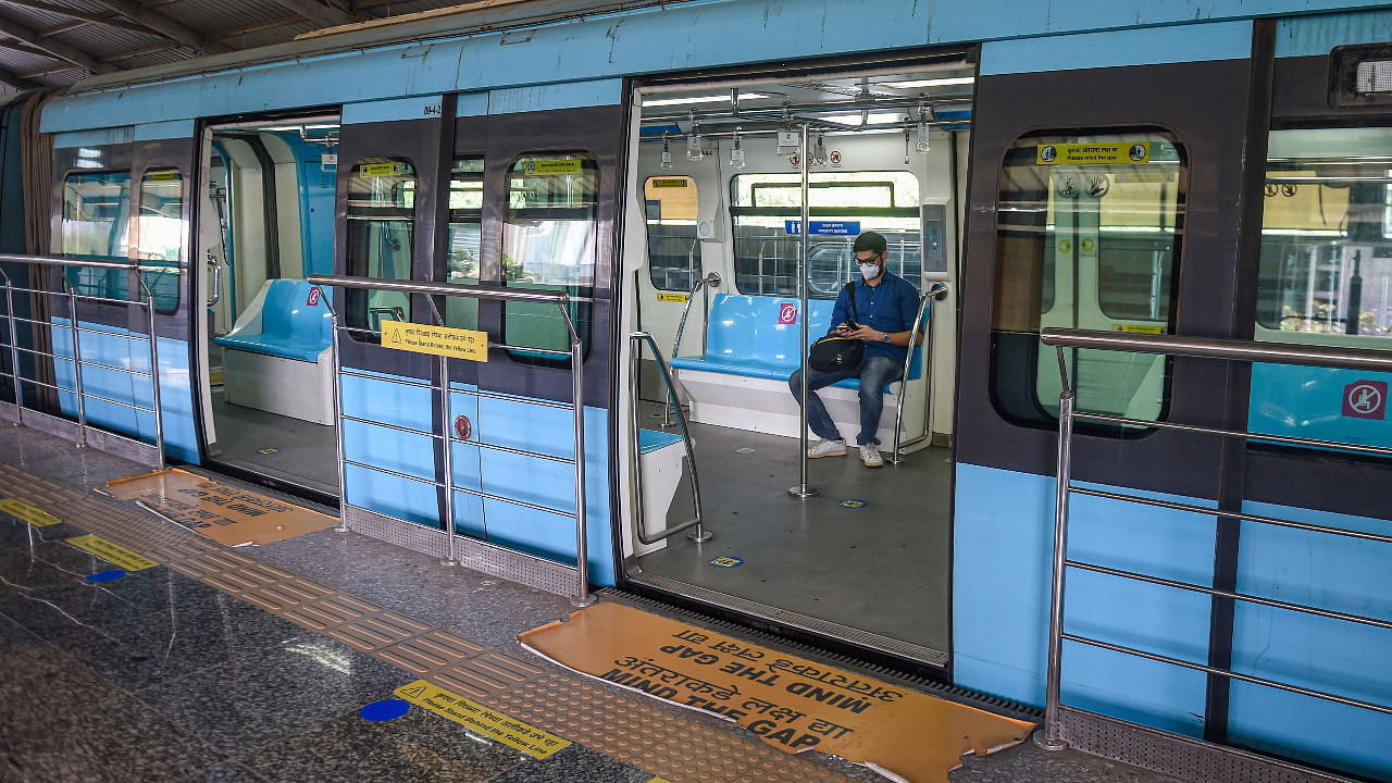 A commuter sits inside an empty Monorail, after authorities allowed its services open to people involved in essential services only, as coronavirus cases surge, in Mumbai. Credit: PTI Photo