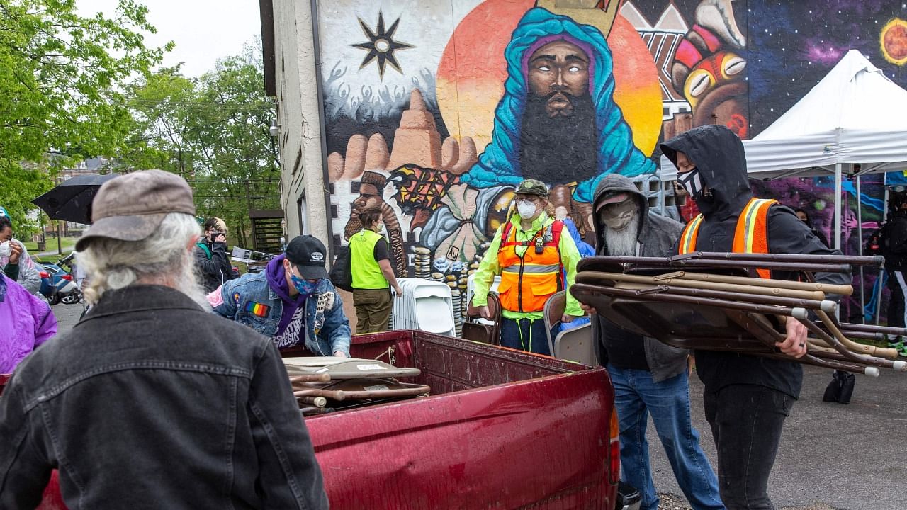 Volunteers at the '24 Hours of Peace' rally breakdown chairs at the rally's meeting point before marching toward City Hall during a Black Lives Matter protest in Nashville, Tennessee on April 24, 2021. Representative Image. Credit: AFP Photo