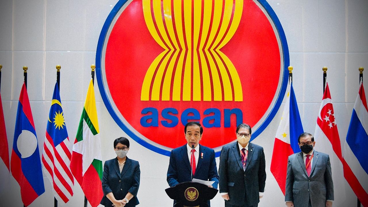 In this photo released by Indonesian Presidential Palace, Indonesian President Joko Widodo, center, delivers his press statement as, from left to right, Foreign Minister Retno Marsudi, Coordinating Minister for Economic Affairs Airlangga Hartarto, and Cabinet Secretary Pramono Anung listen, following ASEAN Leaders' Meeting at the ASEAN Secretariat in Jakarta. Credit: AP/PTI photo