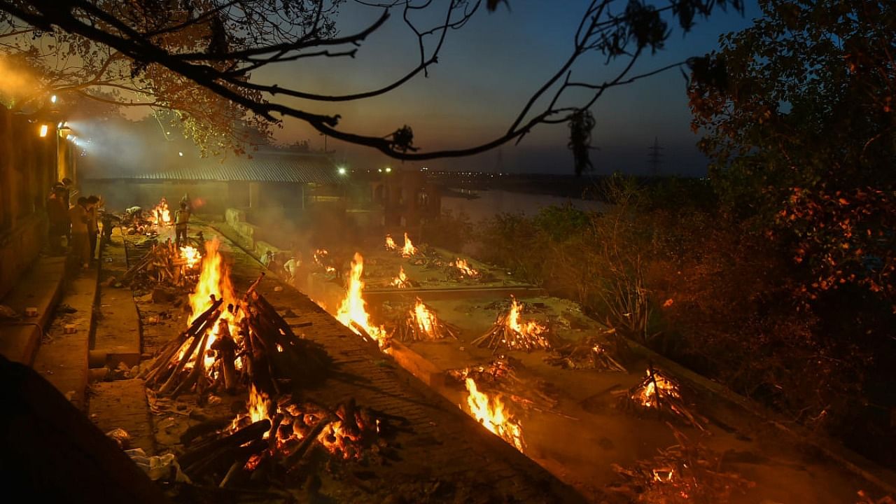  Covid-19 victims being cremated at Bhairav Ghat Hindu Crematory, as coronavirus cases surge in record numbers across the country, in Kanpur. Credit: PTI Photo