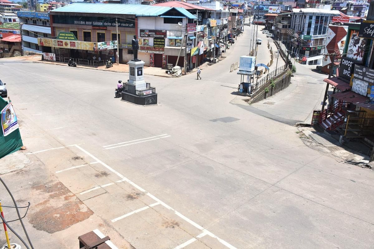 A deserted Ajjamada Devaiah Circle in Madikeri following the imposition of a weekend curfew.