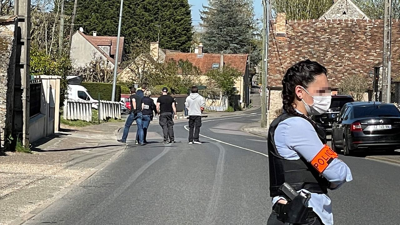 French police forces conduct a search at the house of a Tunisian man who stabbed to death a female police employee. Credit: AFP Photo