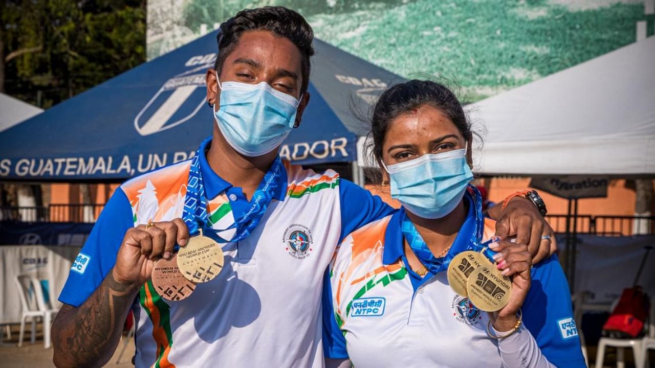 Archery couple Deepika Kumari and Atanu Das with two individual gold medals. Credit: Twitter/@worldarchery
