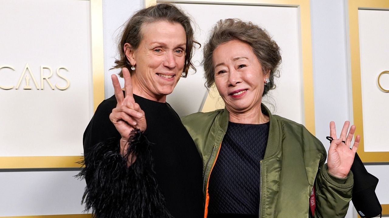 Frances McDormand, winner of the award for best actress in a leading role for "Nomadland" and Yuh-Jung Youn, winner of the award for best actress in a supporting role for 'Minari'. Credit: Reuters Photo