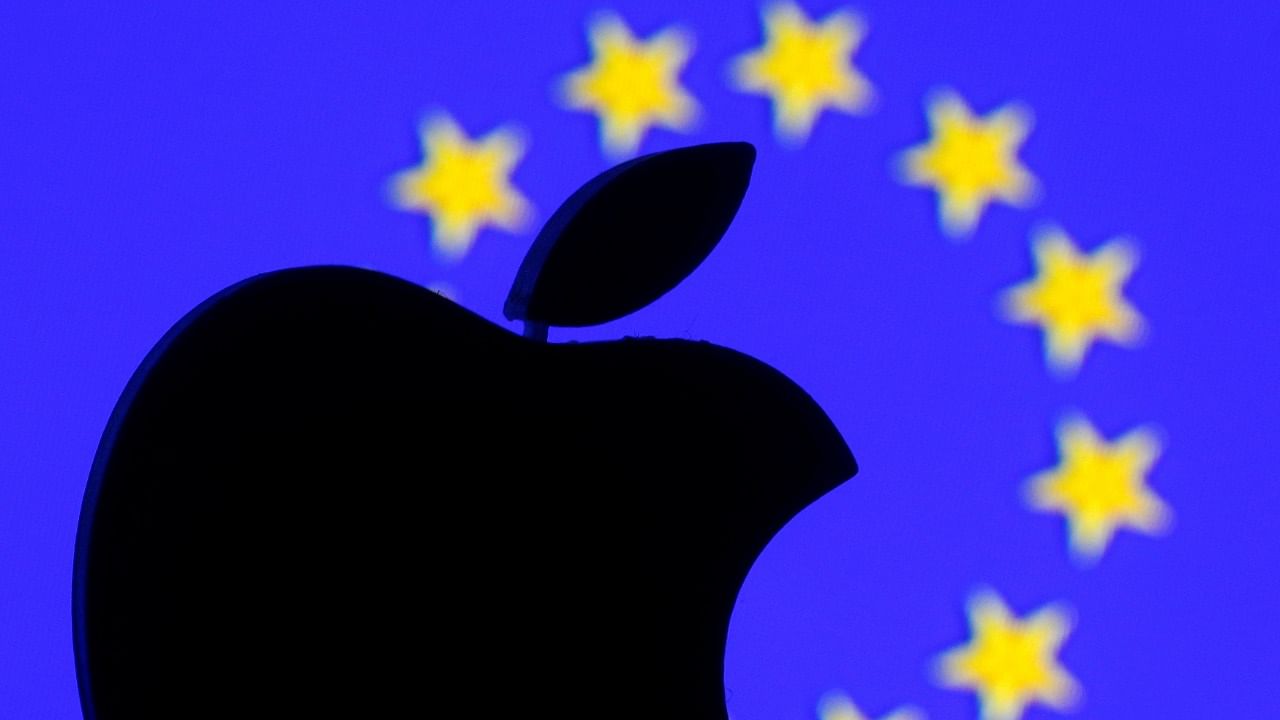 A 3D-printed Apple logo is seen in front of a displayed European Union flag in this illustration. Credit: Reuters File Photo