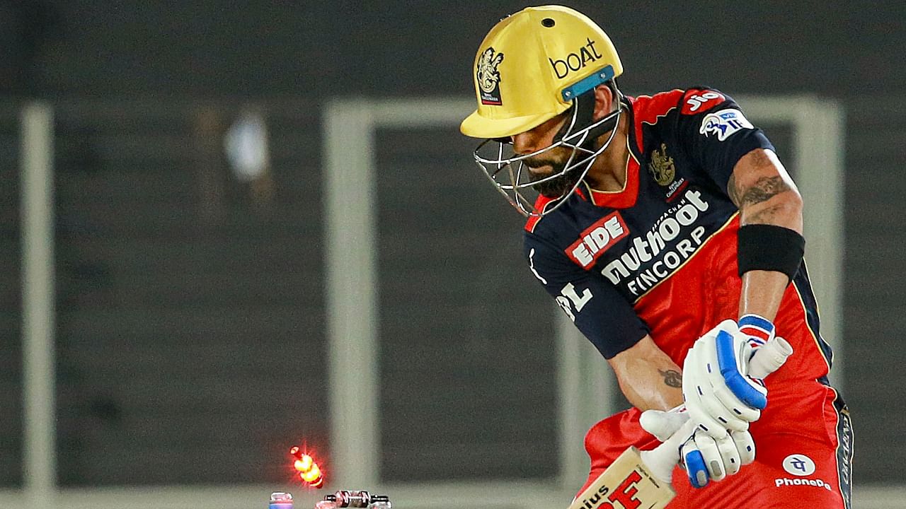 Virat Kohli captain of Royal Challengers Bangalore is bowled by Avesh Khan of Delhi Capitals during the Vivo Indian Premier League 2021 between the Delhi Capitals and the Royal Challengers Bangalore held at the Narendra Modi Stadium, Ahmedabad, Tuesday, April 27, 2021. Credit: PTI Photo