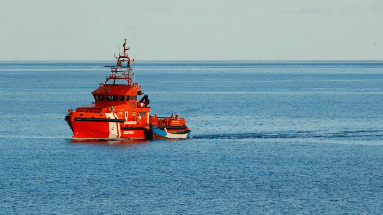 Rescuers from the Spanish Coast Guard tow a boat with the bodies of migrants who were found dead, in Port of Los Cristianos, in the south of the Canary Island of Tenerife, Spain. Credit: Reuters Photo