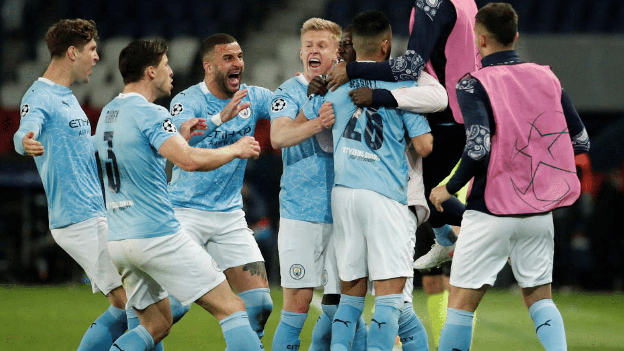 Manchester City's Riyad Mahrez celebrates scoring their second goal with teammates. Credit: Reuters Photo