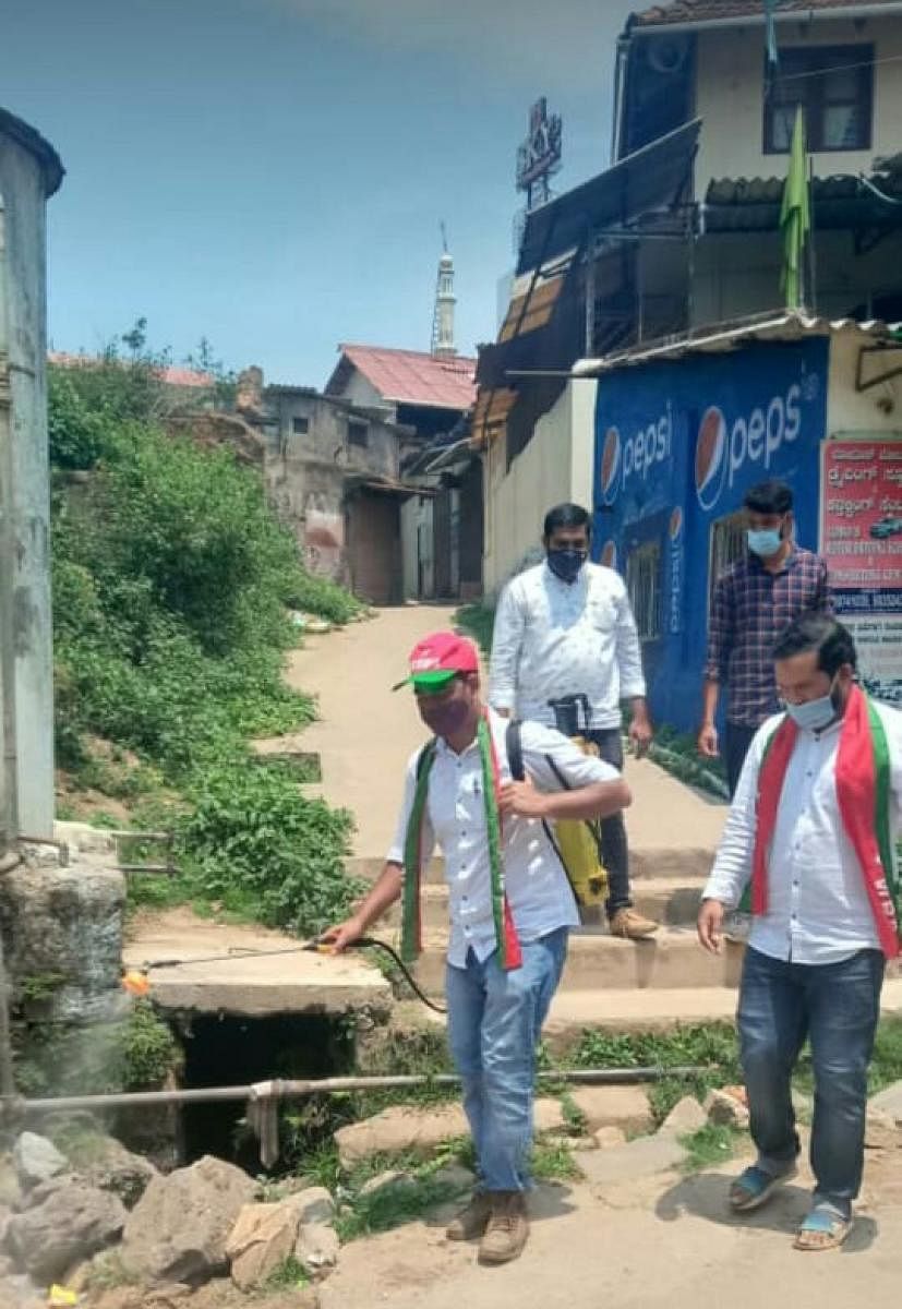 The winning candidate from SDPI, Abdul Bashir, carries out sanitisation in ward number 12, to mark his victory and to create awareness among the public about Covid-19.