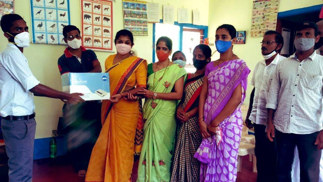 ECG machine was handed over to an anganwadi in Ampar in Kundapur taluk by CAD. Credit: DH Photo
