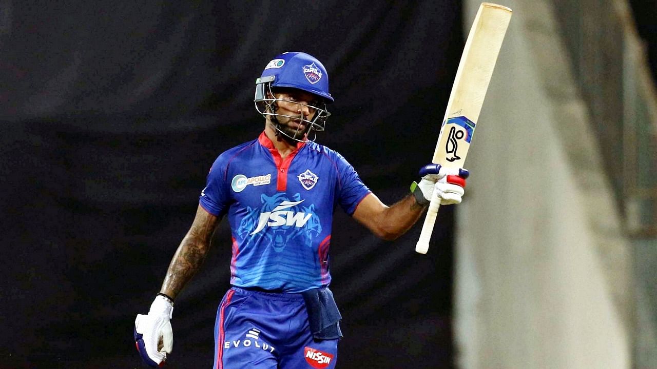Shikhar Dhawan of Delhi Capitals raises his bat after scoring a fifty during match 11 of the Indian Premier League 2021 between the Delhi Capitals and the Punjab Kings. Credit: PTI Photo