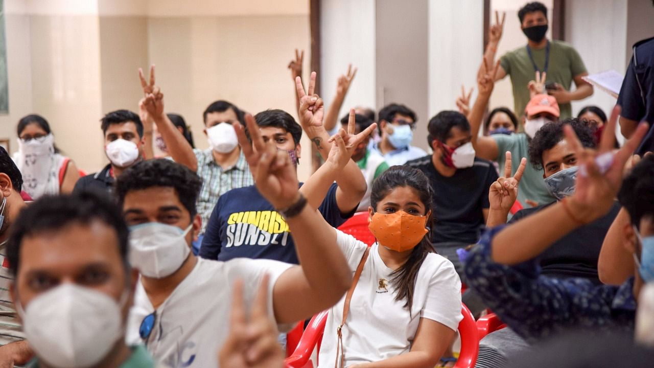 Beneficiaries pose for picture while getting vaccinated against Covid-19, during Vaccination drive for age group from 18-45, at NMMC's Meenatai Thackeray Hospital in Nerul, Saturday, May 1, 2021. Credit: PTI Photo