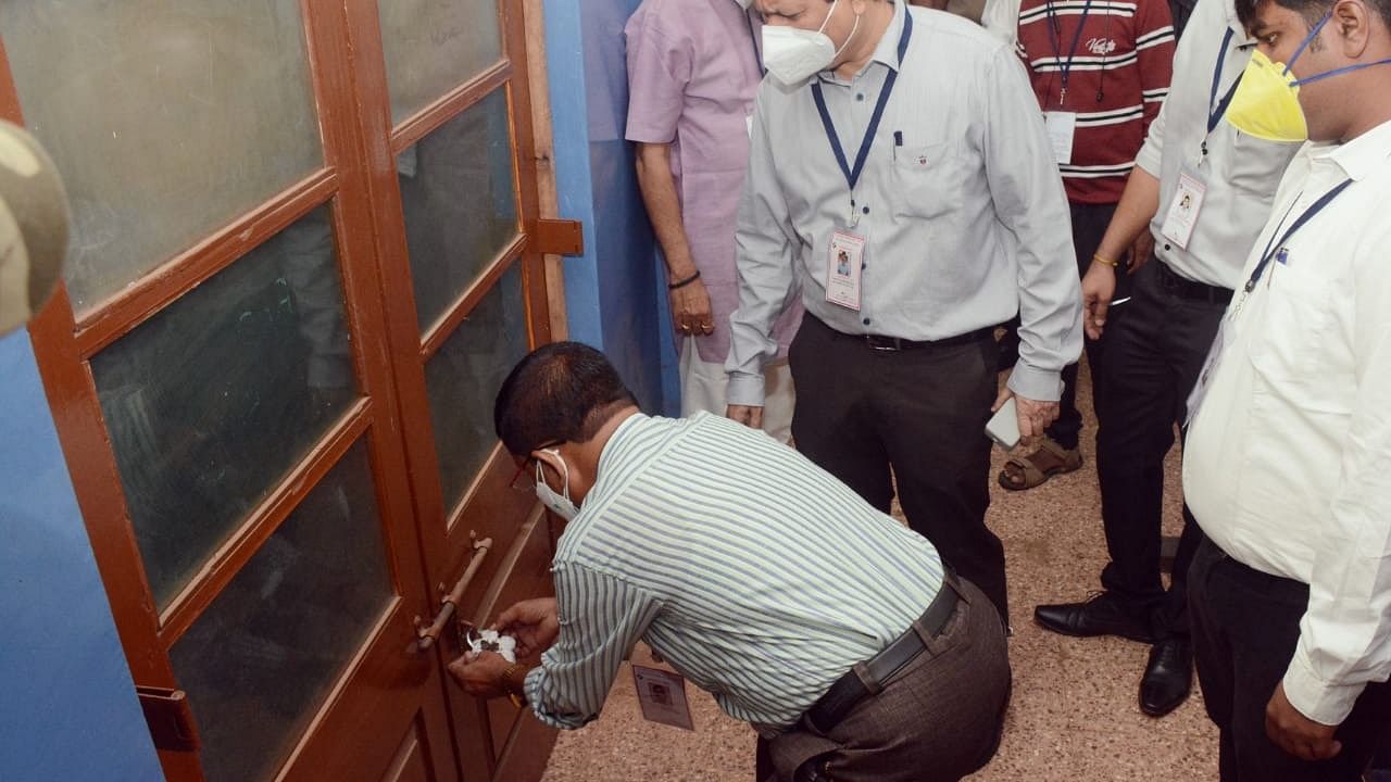 Strongrooms where EVMs of Belgaum Lok Sabha Constituency bye-election are being stored are opened during the commencement of counting in Belagavi on Sunday. Credit: special arrangement