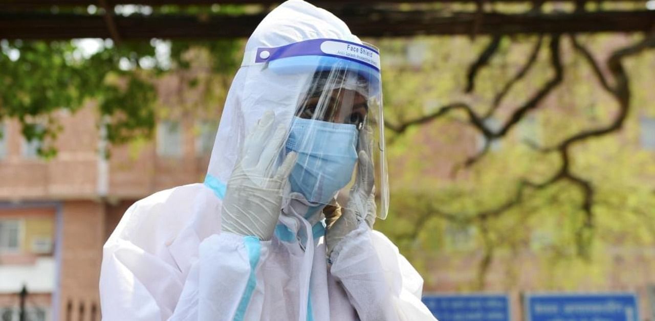 A medic outside LNJP Hospital in New Delhi, Sunday, May 2, 2021. Credit: PTI Photo